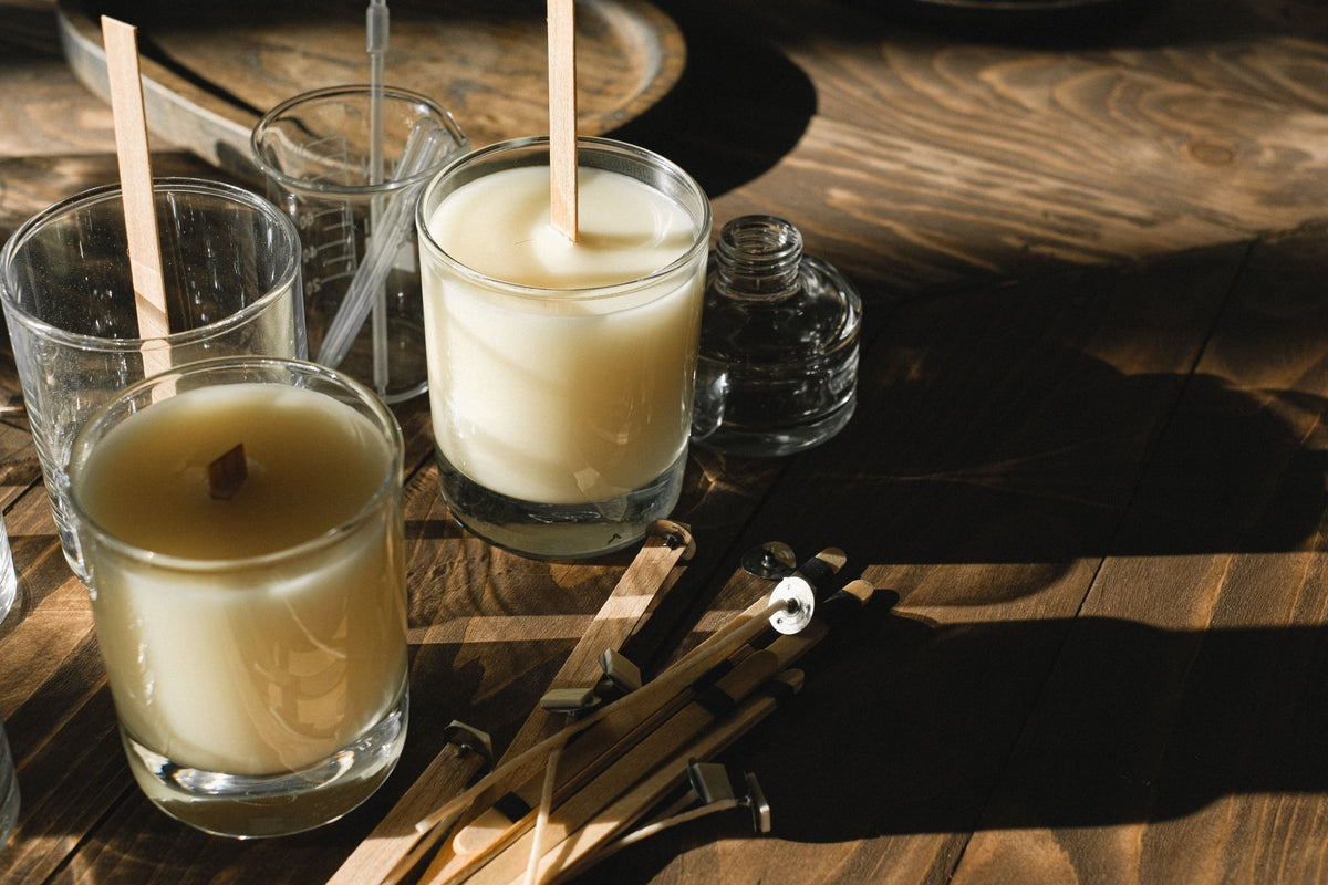 Fixed candles with wooden wicks on an artisan's wooden table