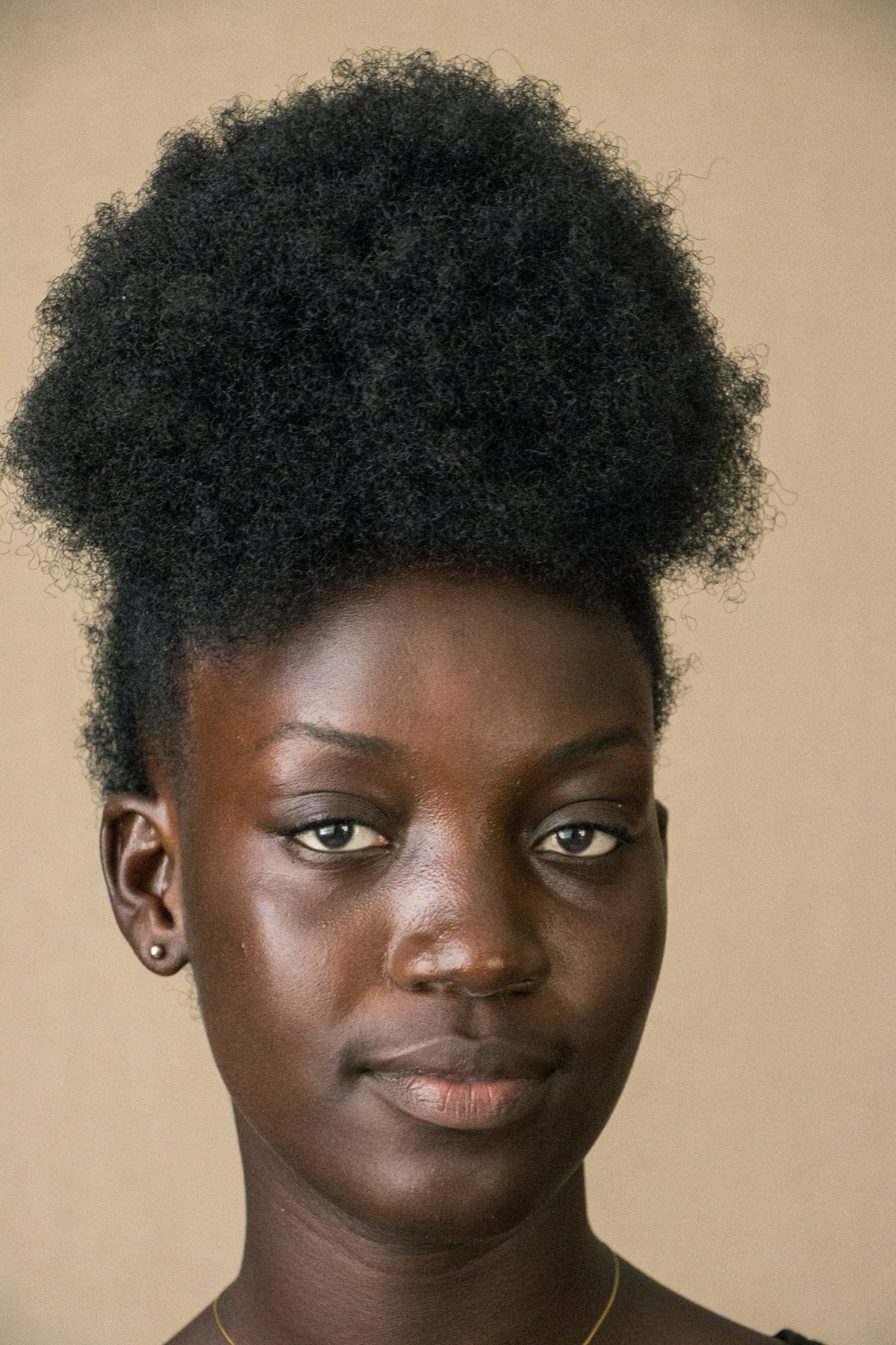 Black woman with natural afro hair, the crown the old folks taught us to guard